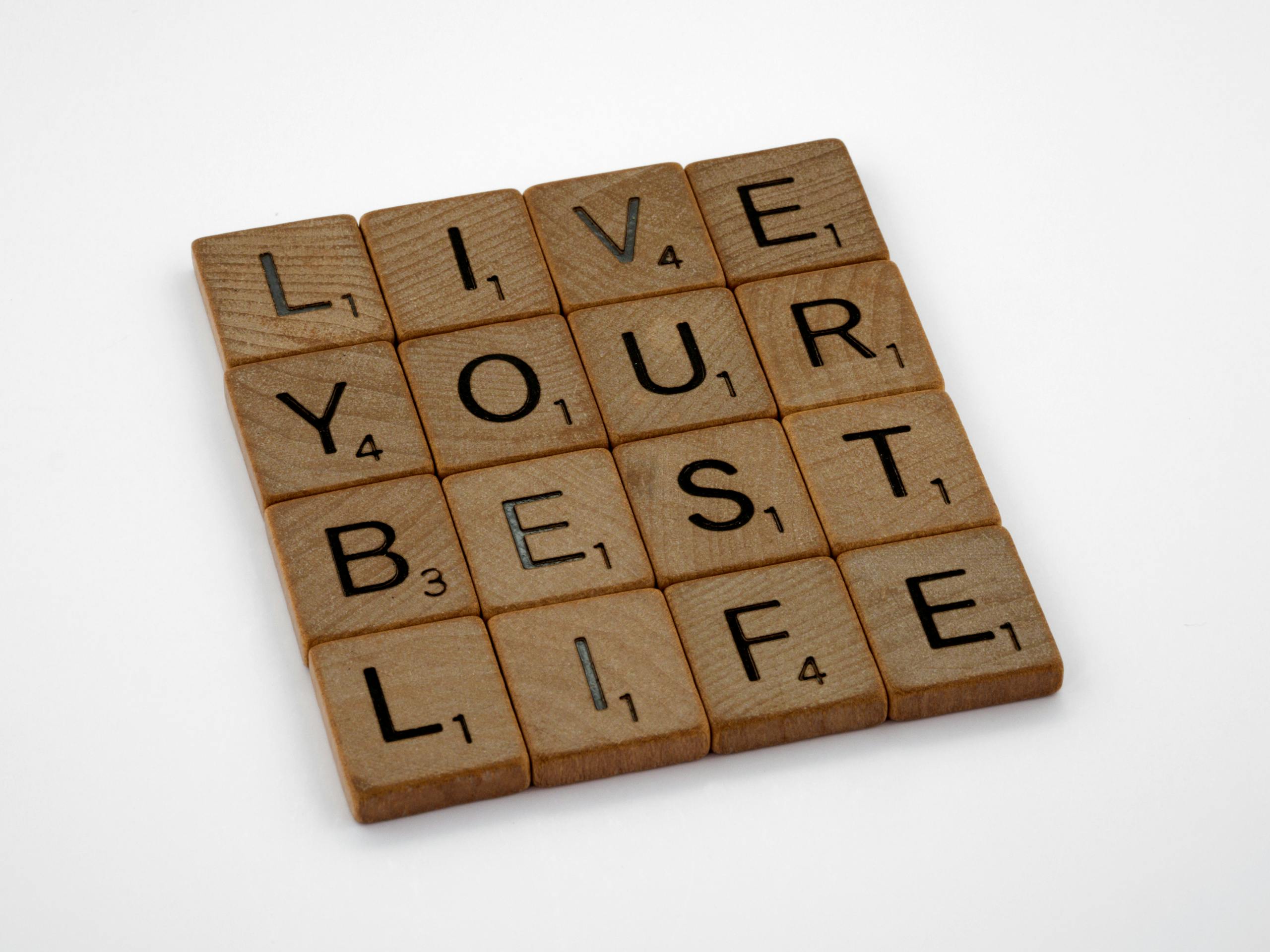 Scrabble letters in a 4 by 4 box that read Live Your Best Life horizontally across