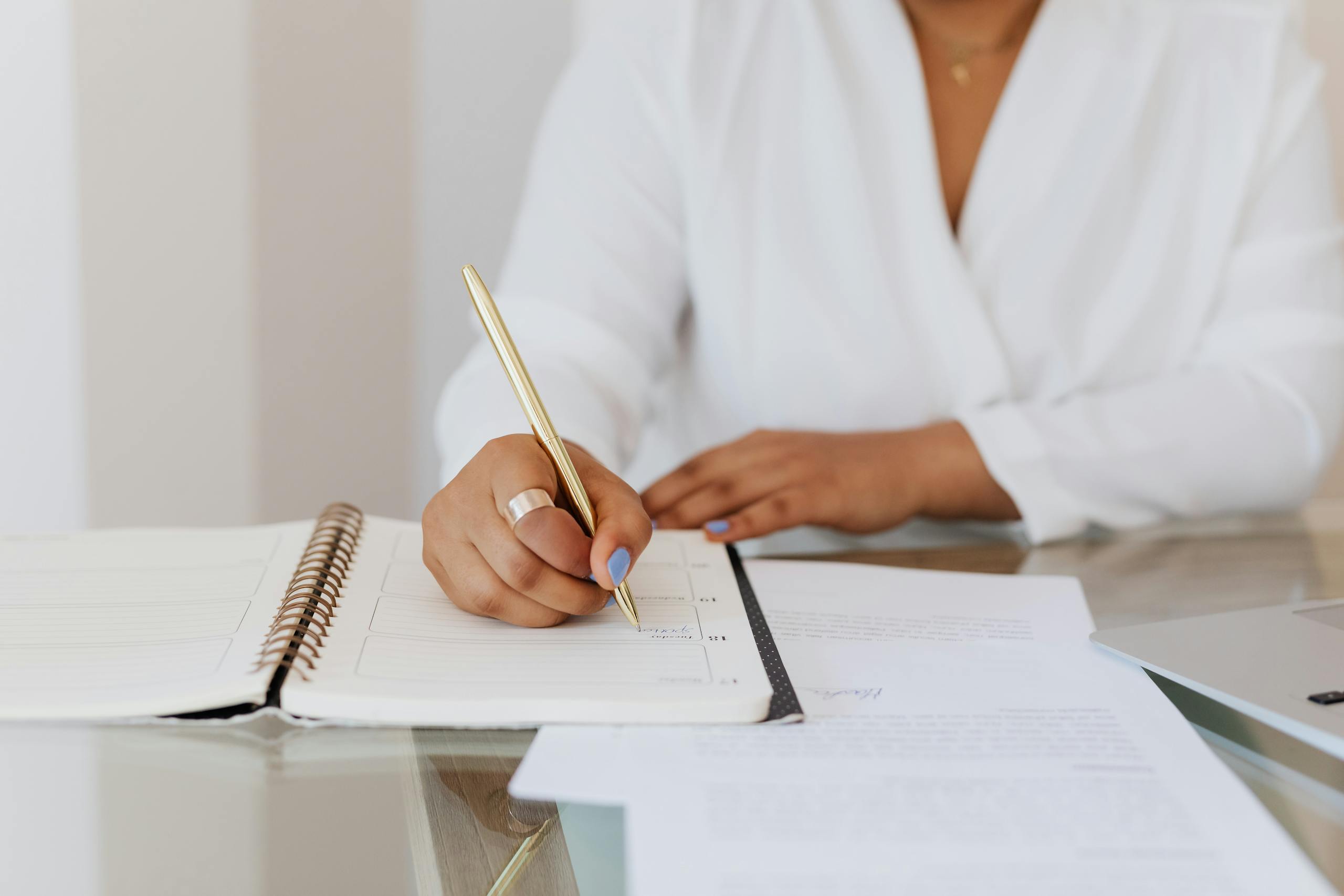 Woman writing in journal reclaiming personal narrative